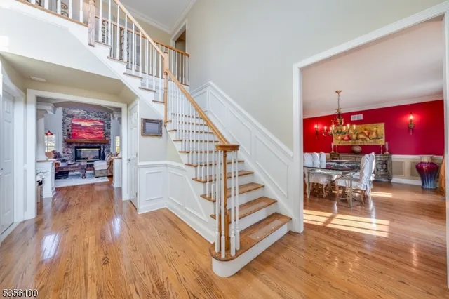 a view of entryway dining room and hall with wooden floor