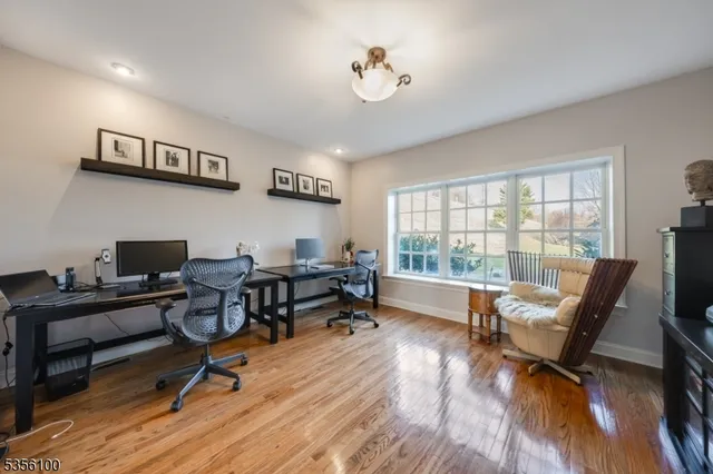 a workspace with wooden floor and a window