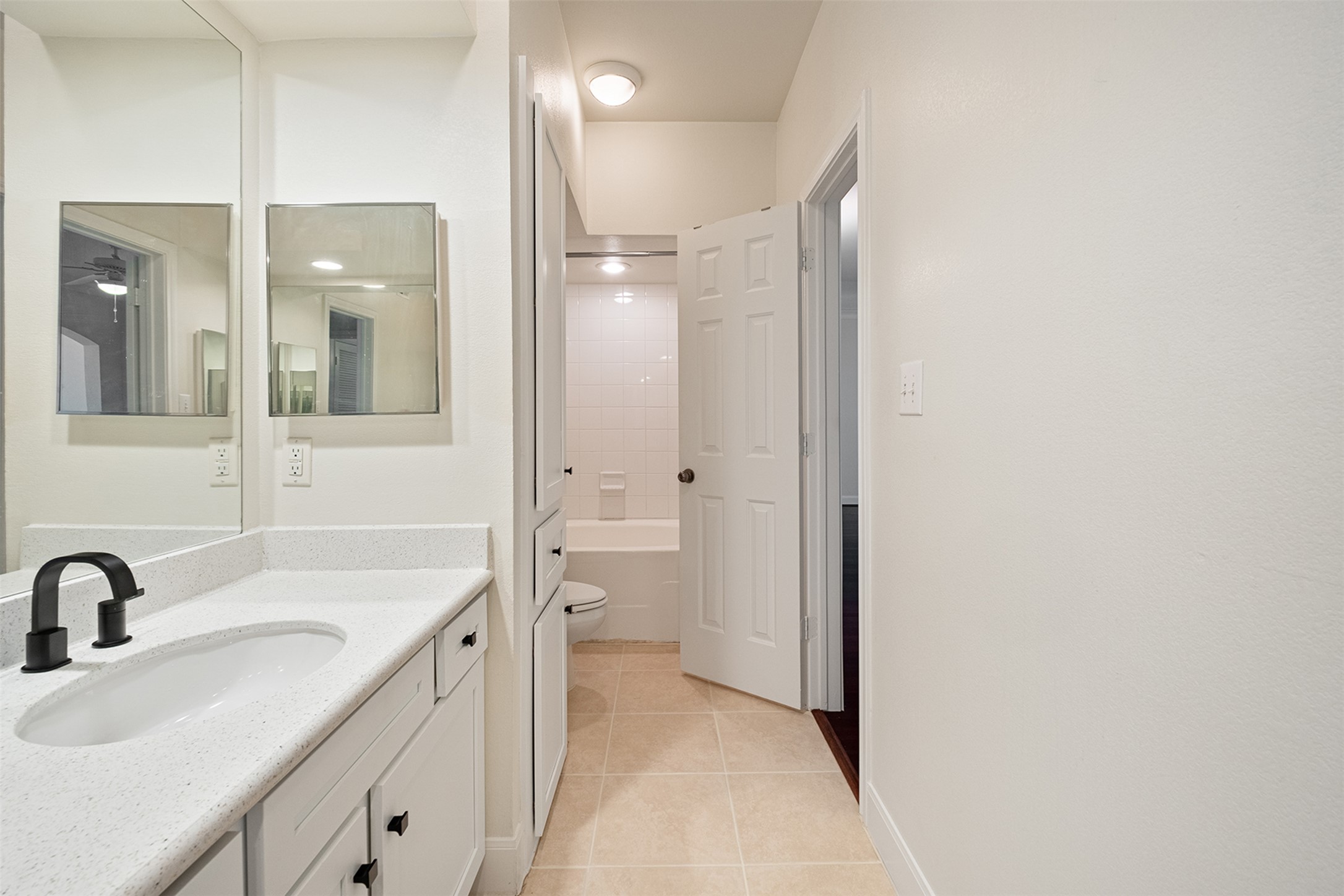 7701 Rialto Boulevard, Unit 637 Austin, TX 78735 - Photo 21 of 25 Bright and clean, this bathroom offers a functional vanity with elegant countertops and a convenient built-in tub/shower combination.