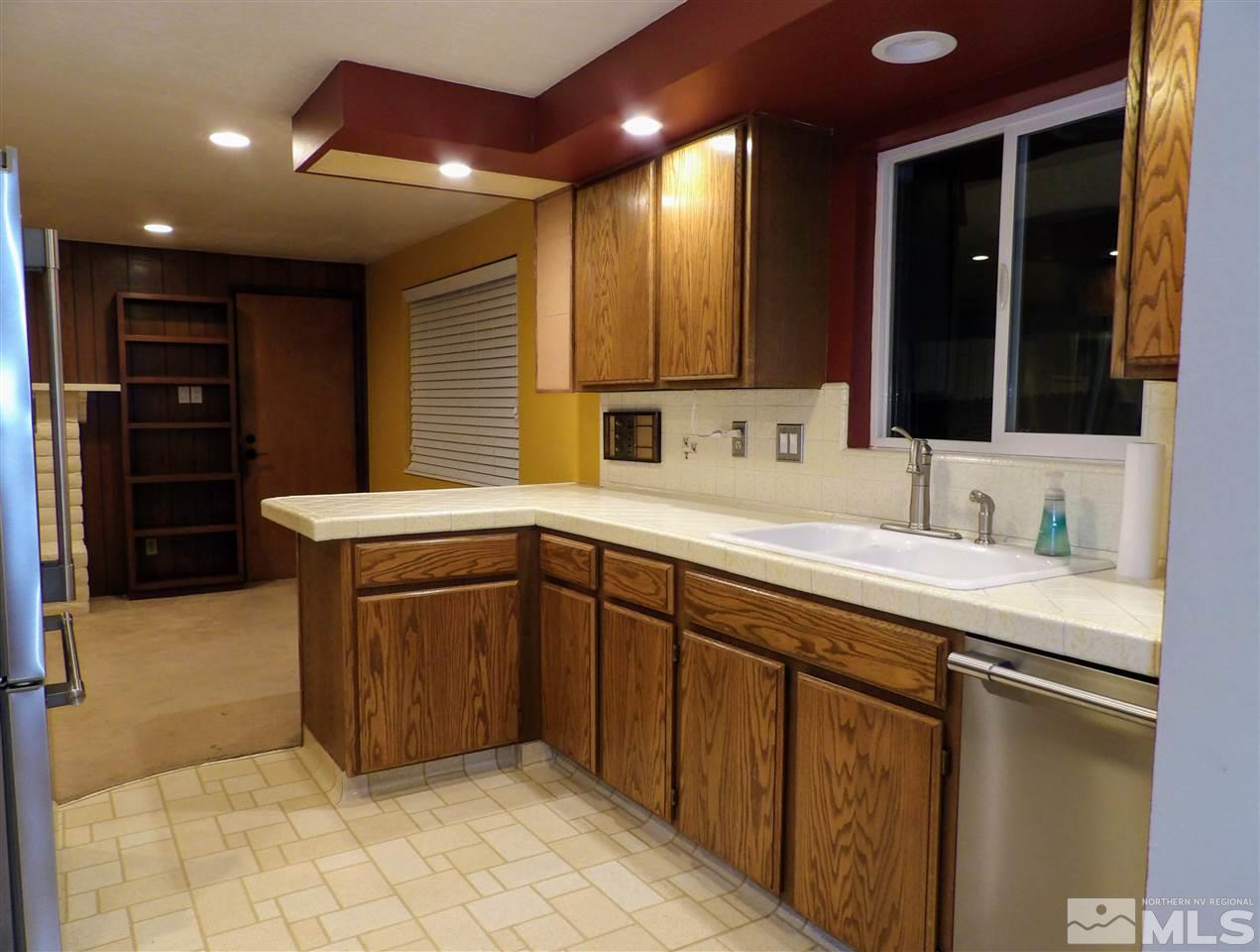 2801 Rowland Road Reno, NV 89509 - Photo 8 of 21 a kitchen with stainless steel appliances granite countertop a sink and cabinets