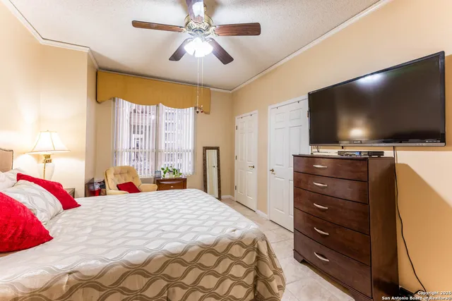 a bathroom with a double vanity sink toilet and shower