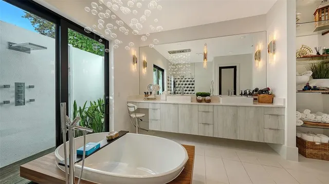 a bathroom with a sink a mirror and a bathtub