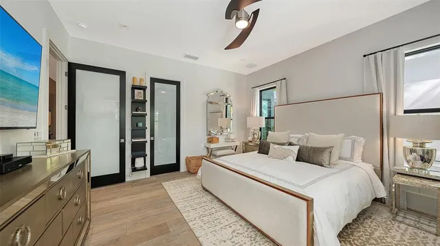 a bedroom with a large bed and a dresser