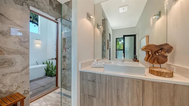 a bathroom with a sink and a mirror