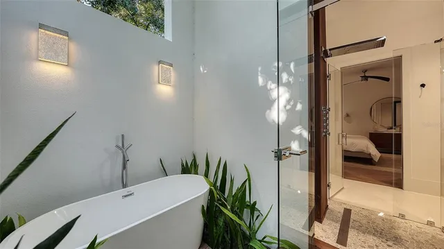 a bathroom with a bathtub and a shower