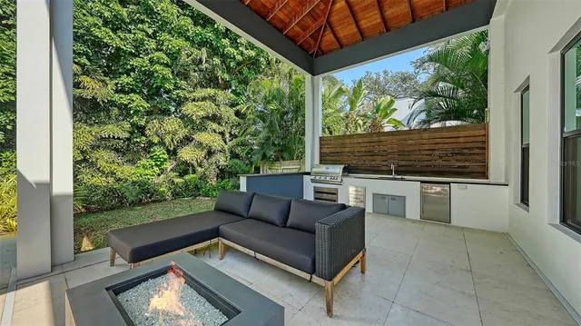 a view of a patio with a table and chairs