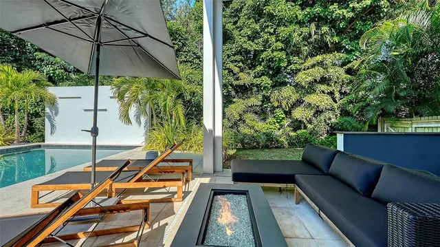 a balcony view with a sitting space