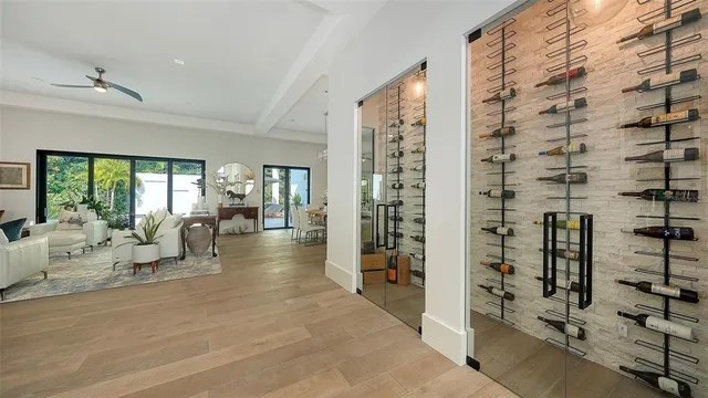 view of hall with living room and floor to ceiling window