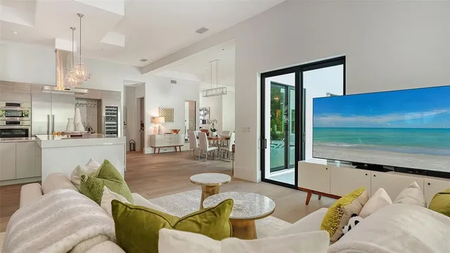 a living room with furniture and a floor to ceiling window