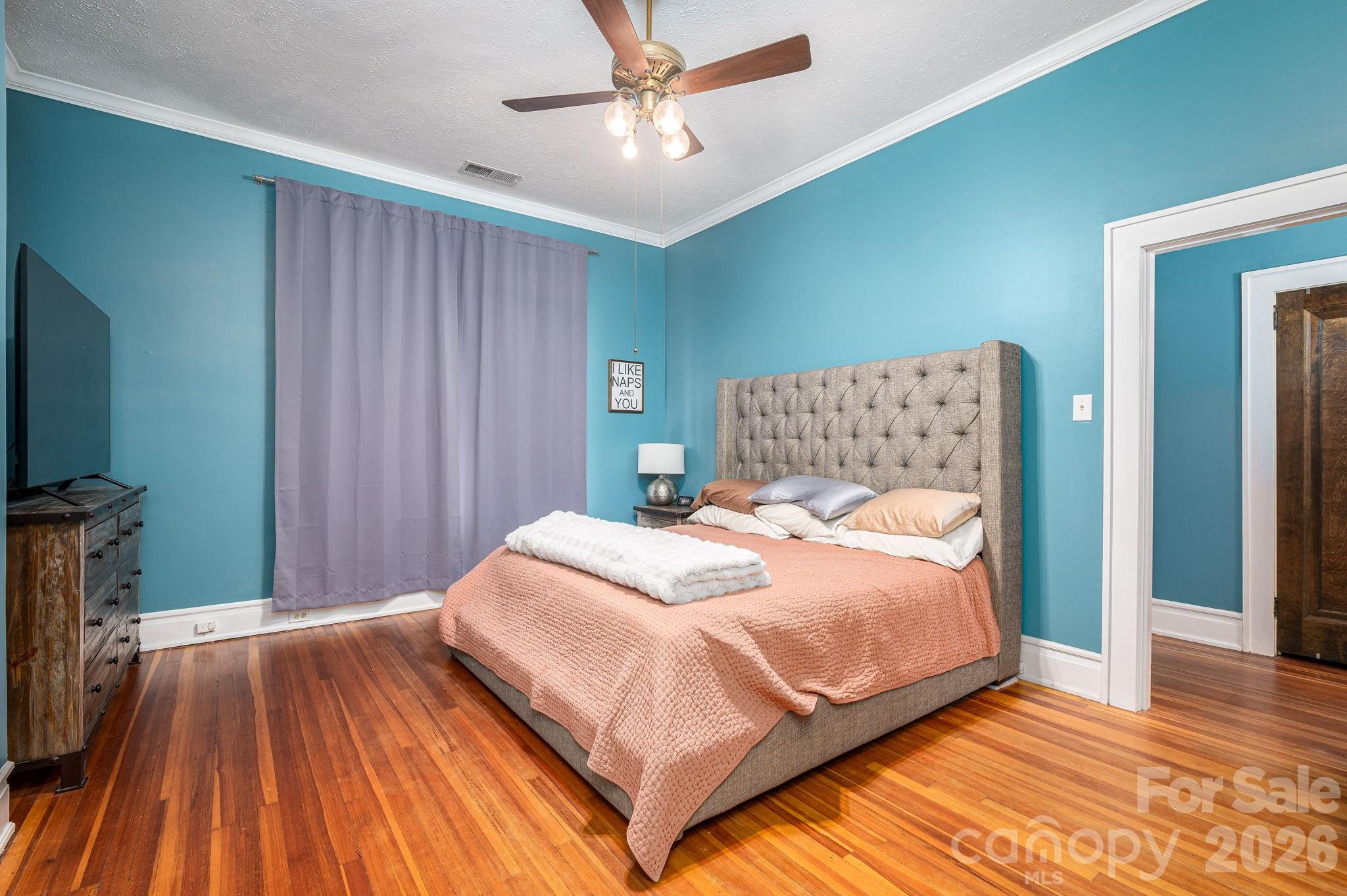 825 Hawthorne Road Shelby, NC 28150 - Photo 24 of 45 a bedroom with a bed and a flat tv screen