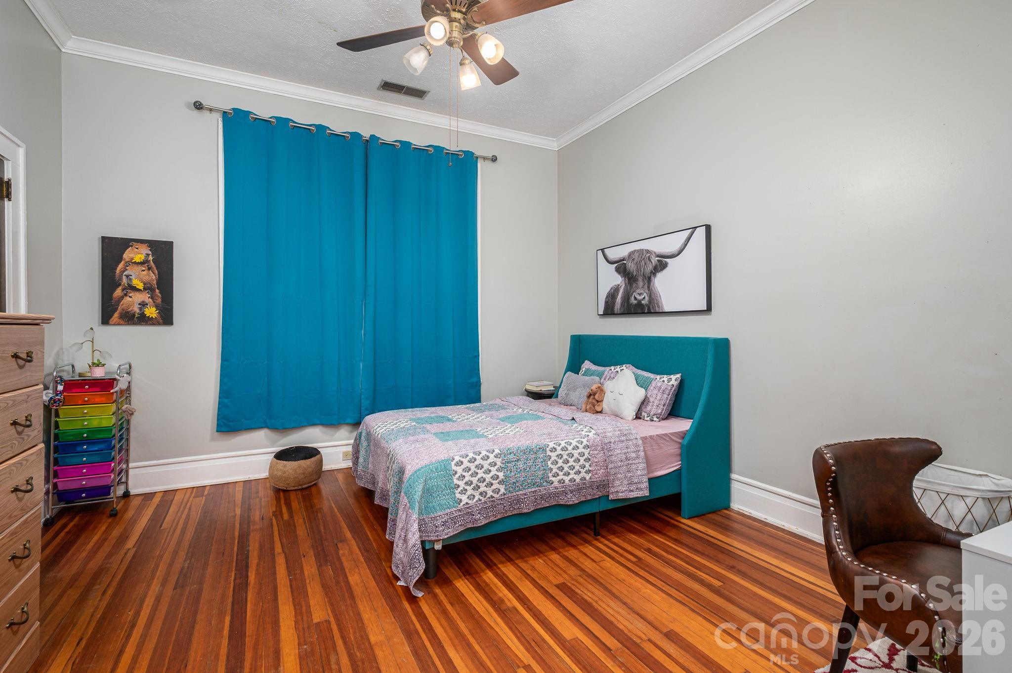 825 Hawthorne Road Shelby, NC 28150 - Photo 29 of 45 a bedroom with a bed and wooden floor