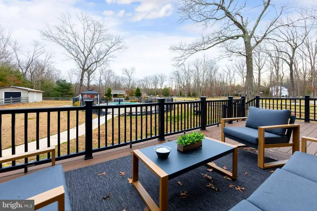 a view of a house with pool and a yard