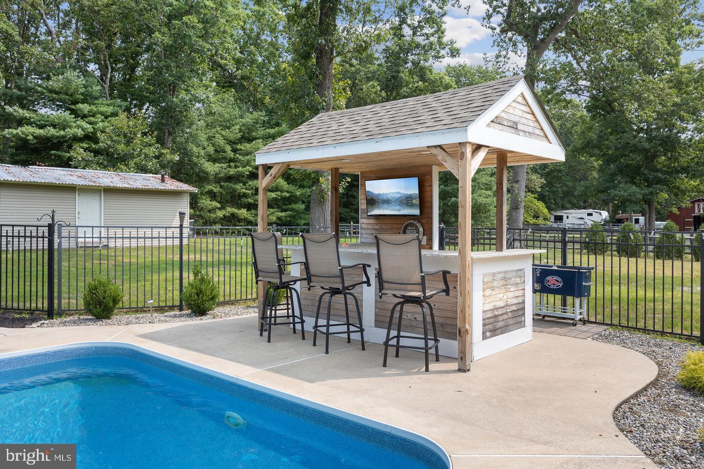 326 Pricketts Mill Road Tabernacle, NJ 08088 - Photo 17 of 62 Charming poolside bar for summer relaxation.