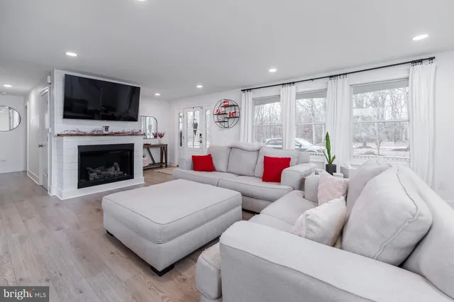 a large kitchen with a table and chairs