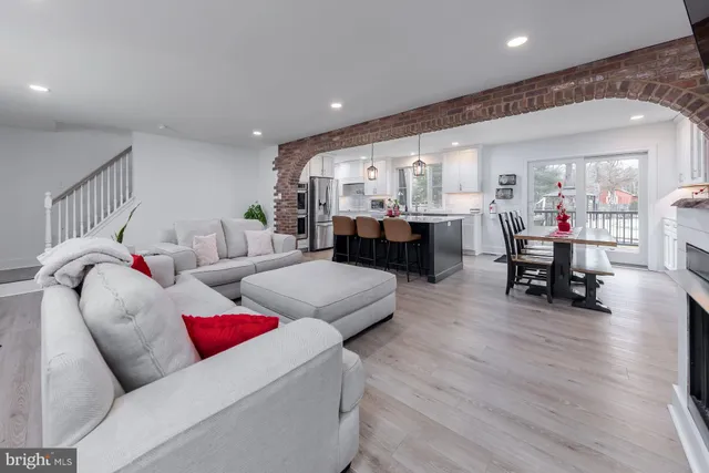 a kitchen with counter top space a sink stainless steel appliances and cabinets