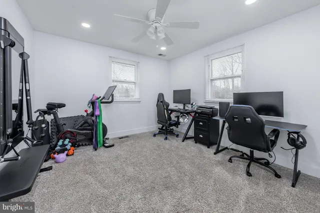a bathroom with a double vanity sink a large mirror and a shower