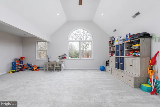 a lobby with a table and chairs