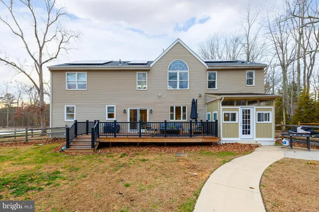 a view of a patio with iron fence