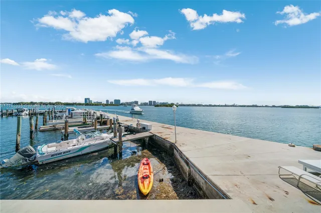 a view of swimming pool with outdoor seating and yard