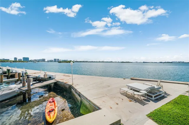 an aerial view of a house with a lake view