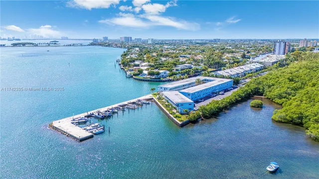 a view of a hallway with wooden floor and entryway