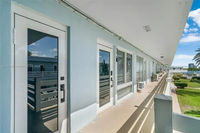 a kitchen with stainless steel appliances refrigerator sink and cabinets