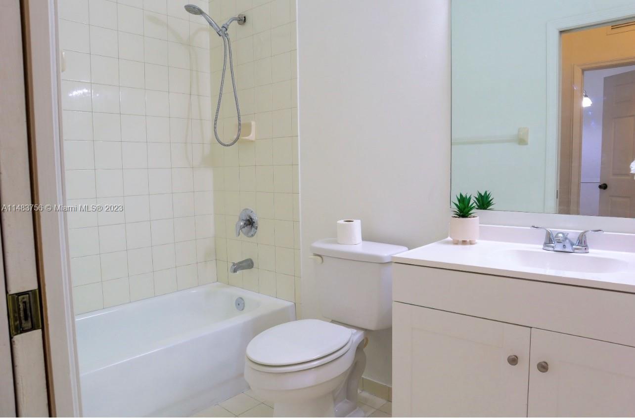 1548 Southwest 2nd Street Homestead, FL 33030 - Photo 11 of 15 a bathroom with a sink a toilet and shower