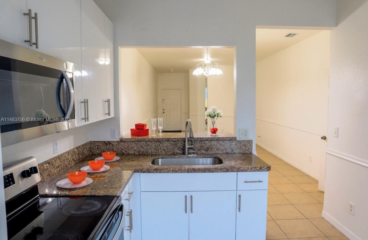 1548 Southwest 2nd Street Homestead, FL 33030 - Photo 7 of 15 a bathroom with a sink and a mirror