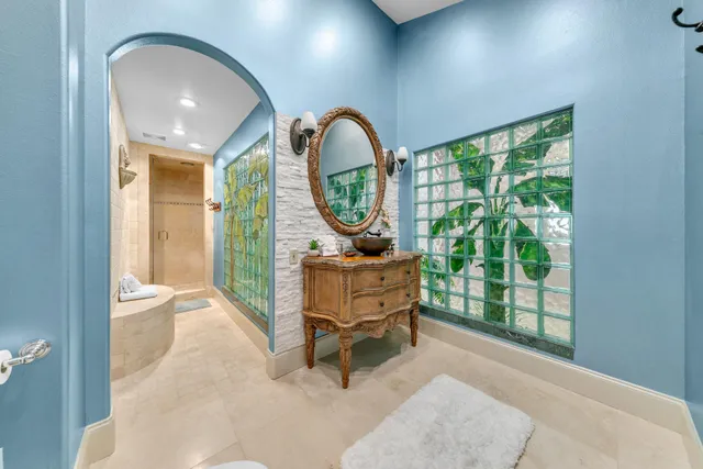 a living room with a couch and a ceiling fan