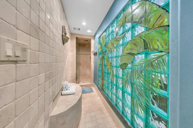 a bathroom with a shower curtain and a sink