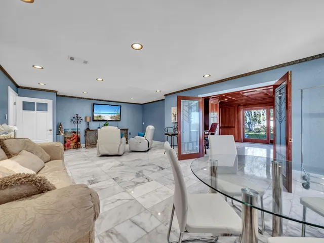 a view of a house with a yard and a tree