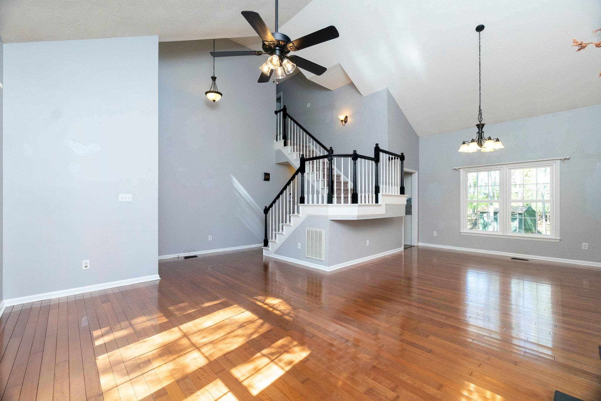102 Waverly Place Durham, NC 27713 - Photo 4 of 12 a view of an entryway with a chandelier