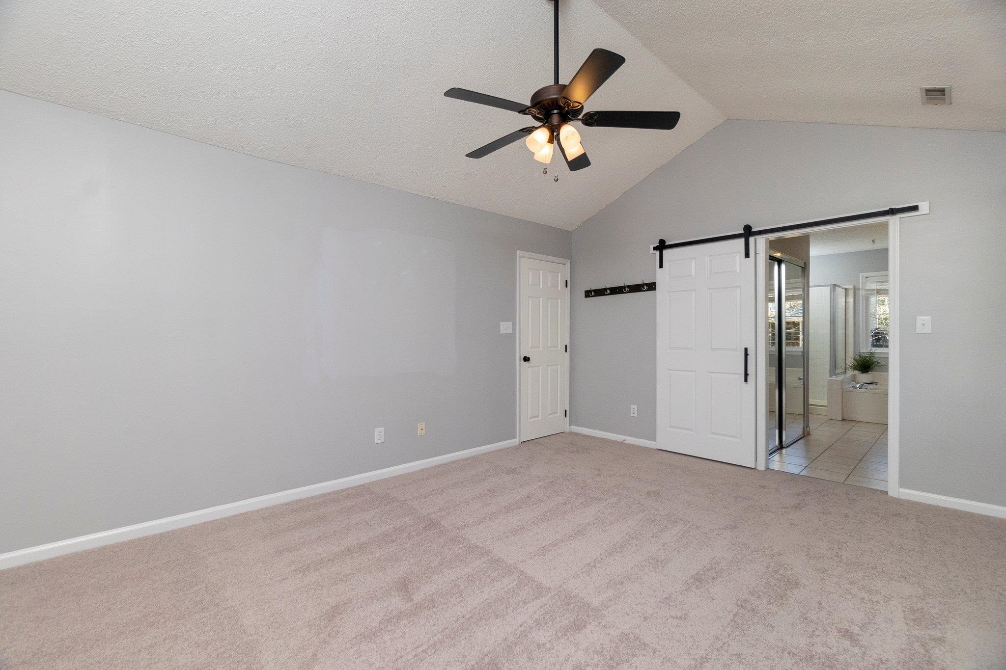 102 Waverly Place Durham, NC 27713 - Photo 7 of 12 an empty room with a fan and a fan