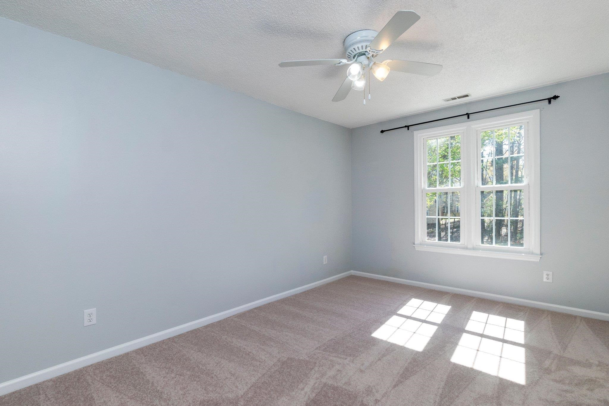 102 Waverly Place Durham, NC 27713 - Photo 10 of 12 a view of an empty room with a window