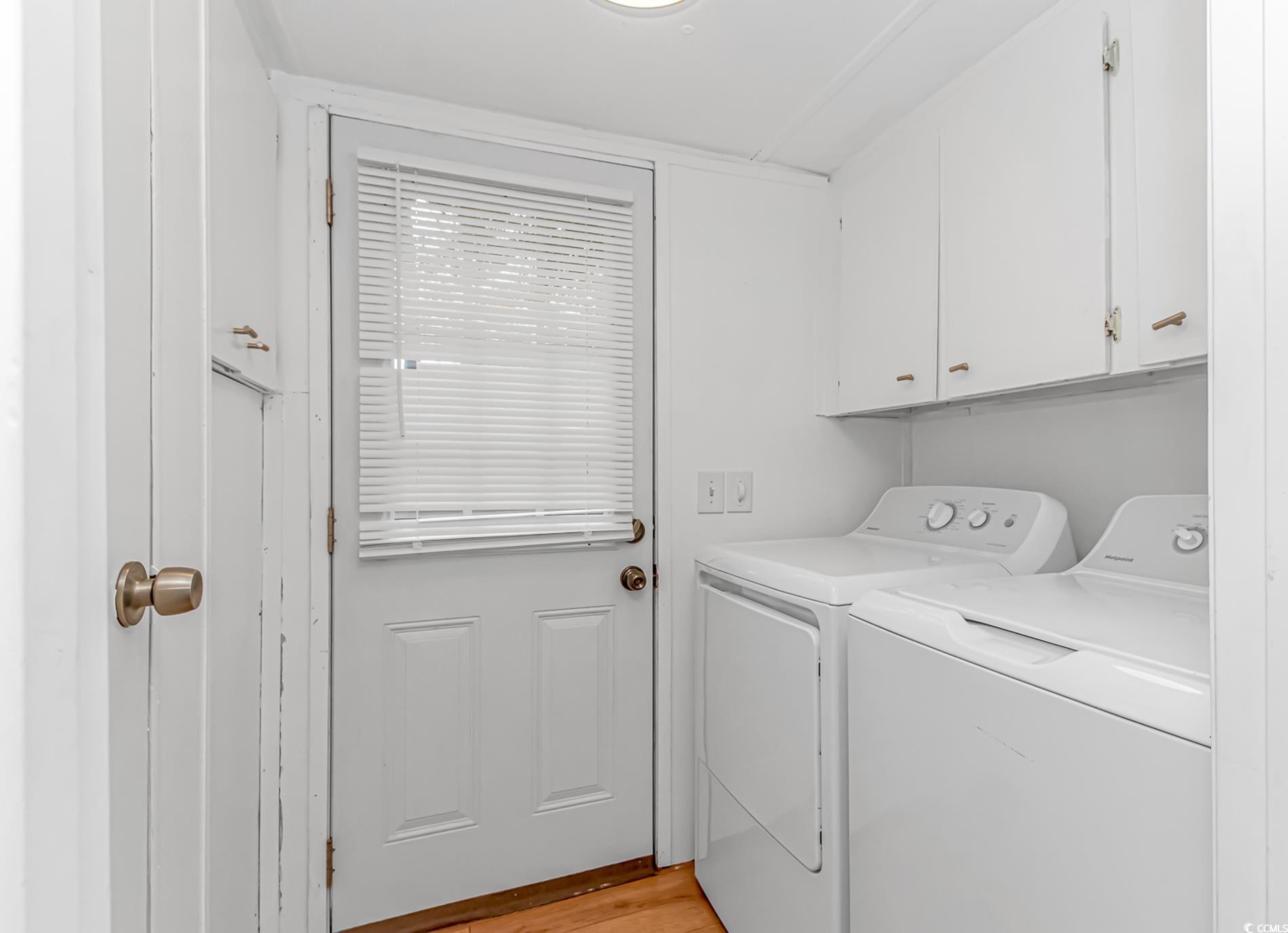 159 Offshore Drive Murrells Inlet, SC 29576 - Photo 12 of 35 Washroom featuring washer and dryer, cabinet space, and light wood-style floors