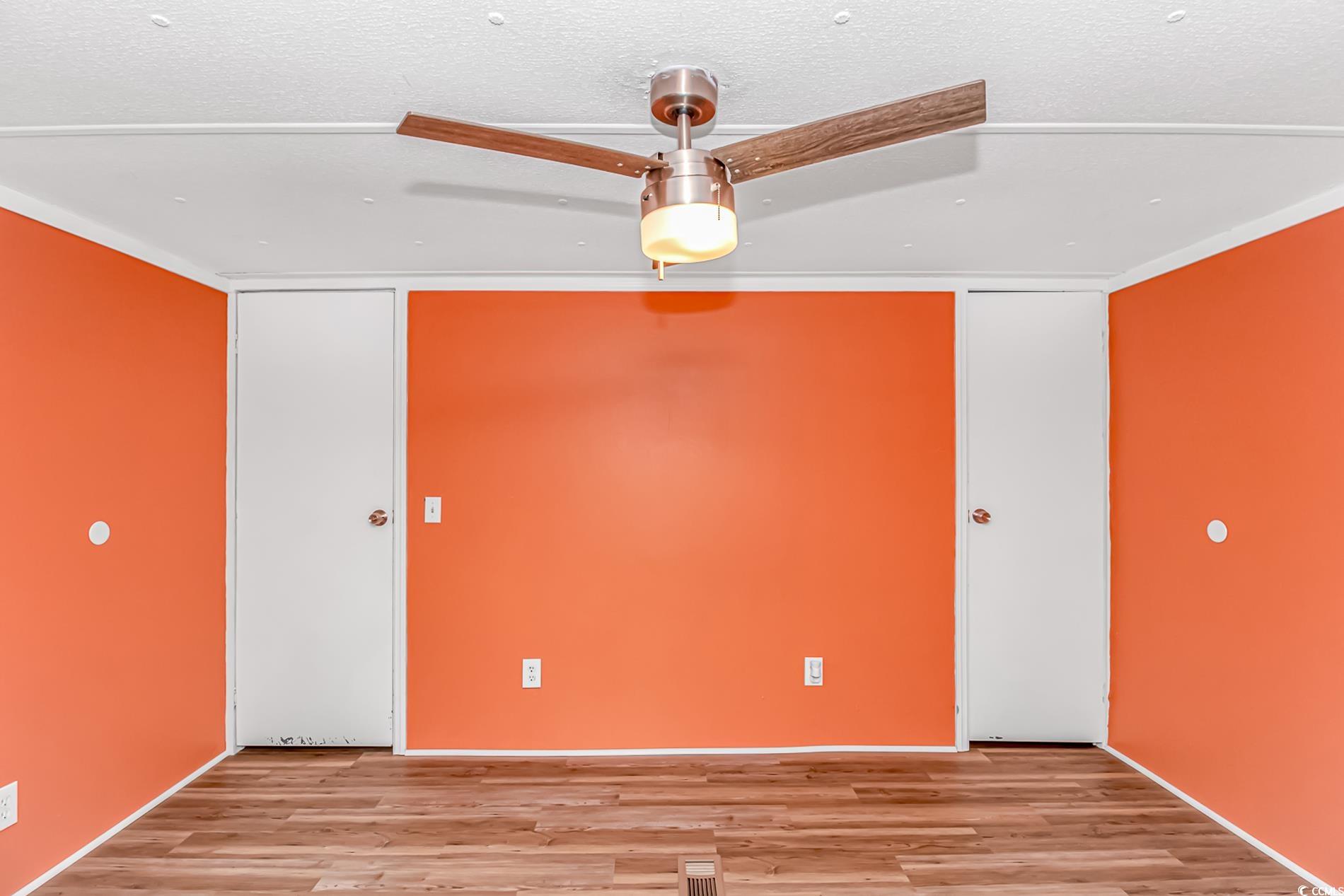 159 Offshore Drive Murrells Inlet, SC 29576 - Photo 22 of 35 Empty room featuring light wood finished floors and a textured ceiling
