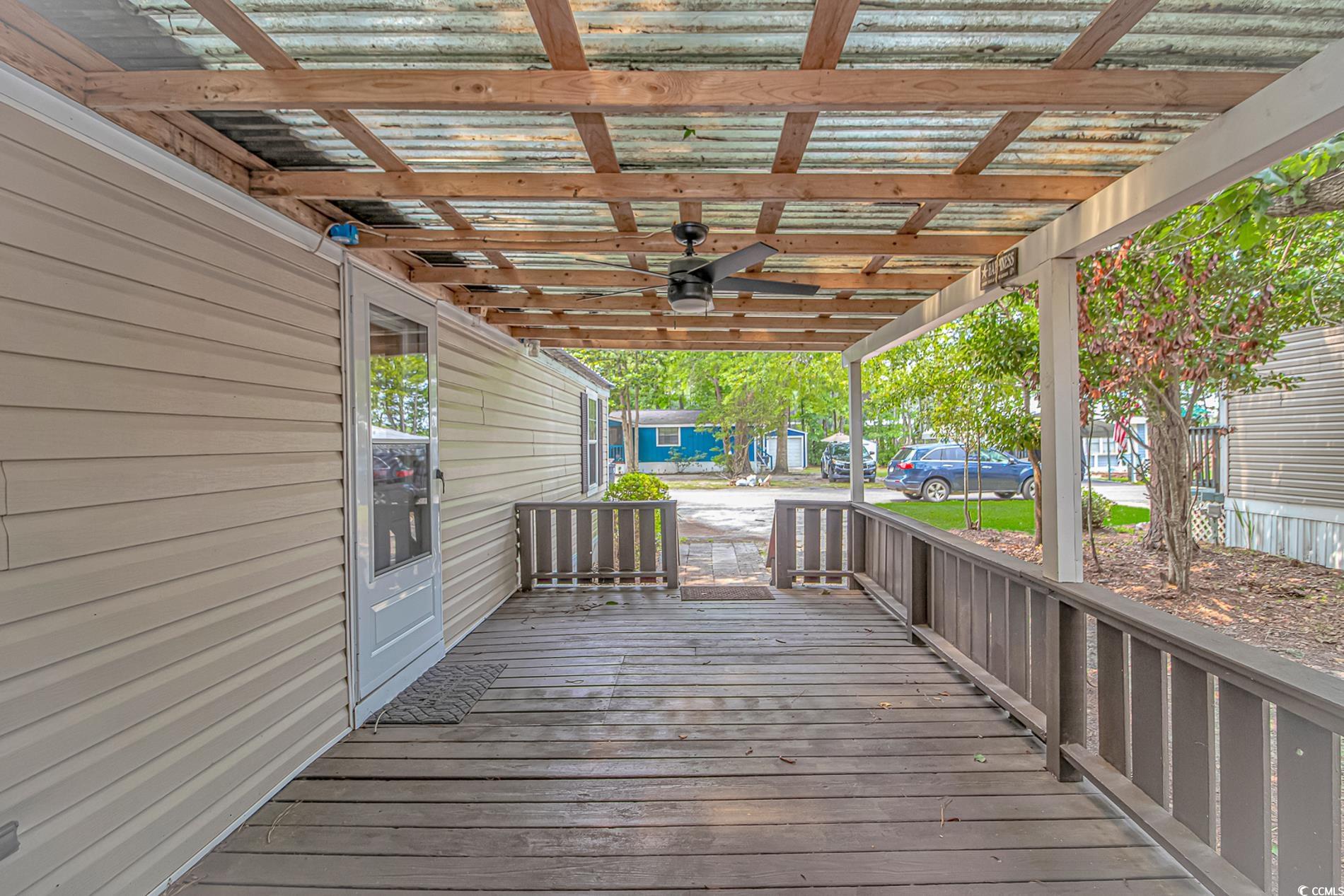 159 Offshore Drive Murrells Inlet, SC 29576 - Photo 4 of 35 Wooden terrace featuring ceiling fan