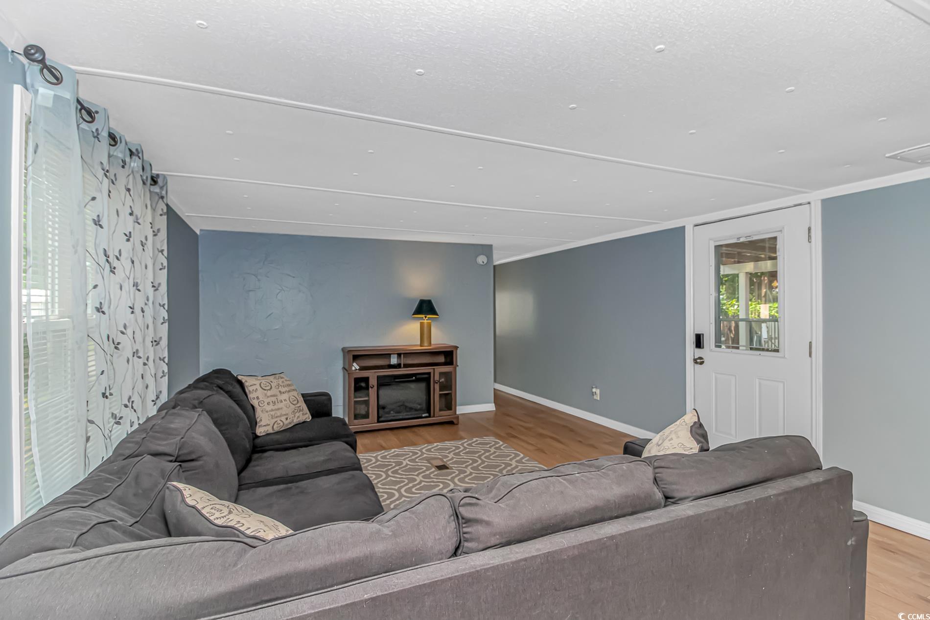 159 Offshore Drive Murrells Inlet, SC 29576 - Photo 6 of 35 Living room with wood finished floors and baseboards