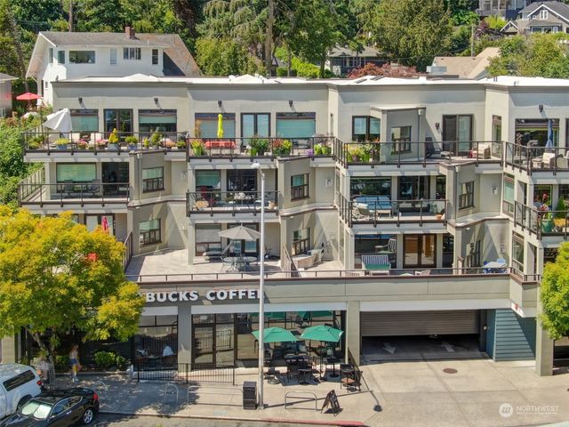 a front view of a building with a garden