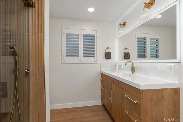 a bathroom with a sink and a window