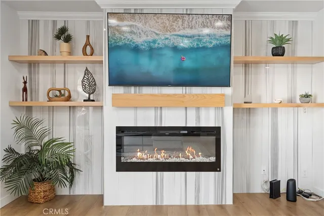 a view of fireplace with wooden floor