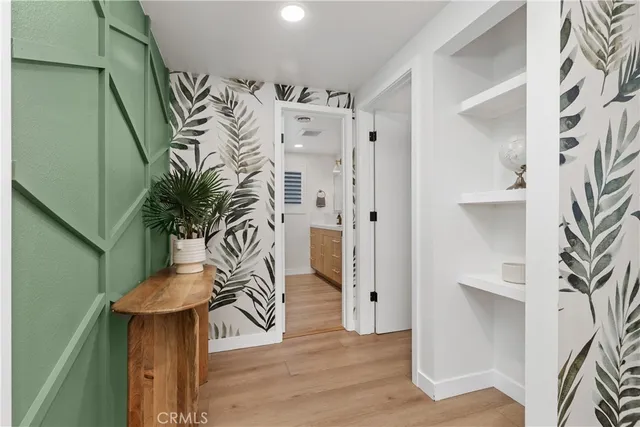 a view of entryway with wooden floor and a potted plant