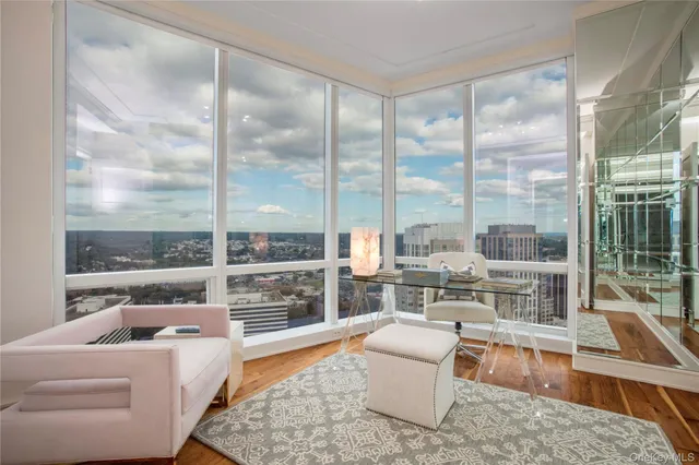 a bathroom with a tub mirror and window