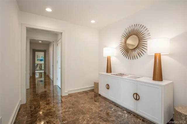 a bedroom with a bed and glass window