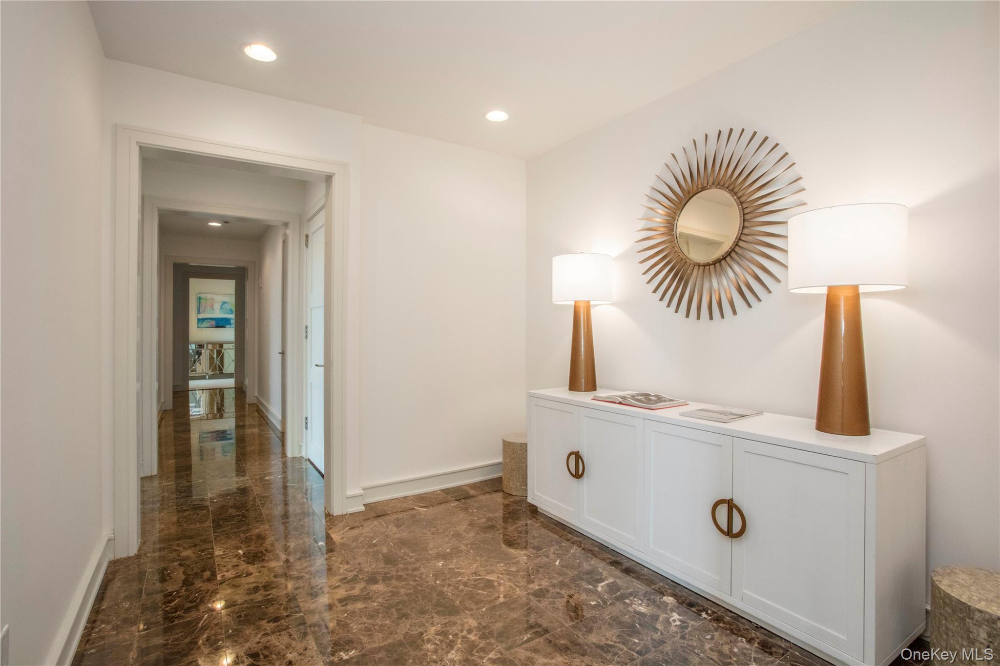 1 Renaissance Square, Unit PH4CD White Plains, NY 10601 - Photo 22 of 25 a kitchen with a sink and a mirror