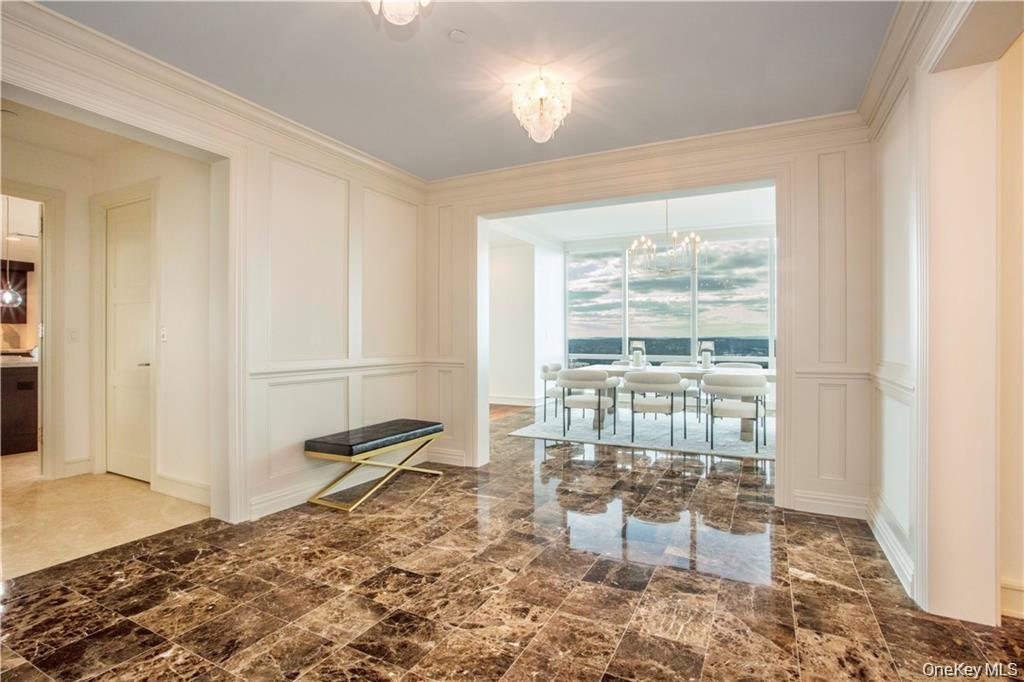 1 Renaissance Square, Unit PH4CD White Plains, NY 10601 - Photo 23 of 25 a bedroom with a bed and glass window