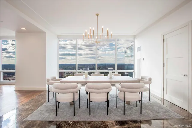 a very nice looking dining room with a table and chairs