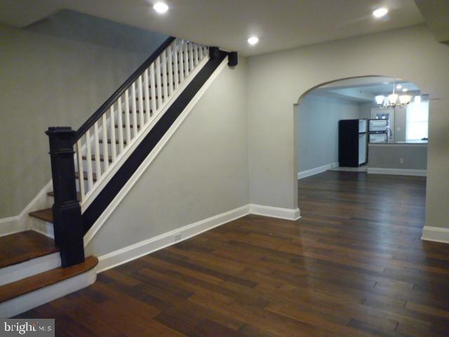 5118 Harford Road Baltimore, MD 21214 - Photo 5 of 41 an entryway in a hall with a window and wooden floor