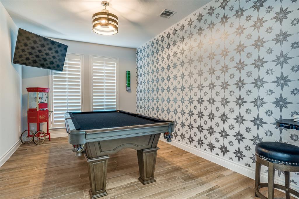 880 Manchester Avenue Prosper, TX 75078 - Photo 13 of 26 a room with chairs and wooden floor