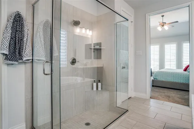 a bathroom with a shower and a sink